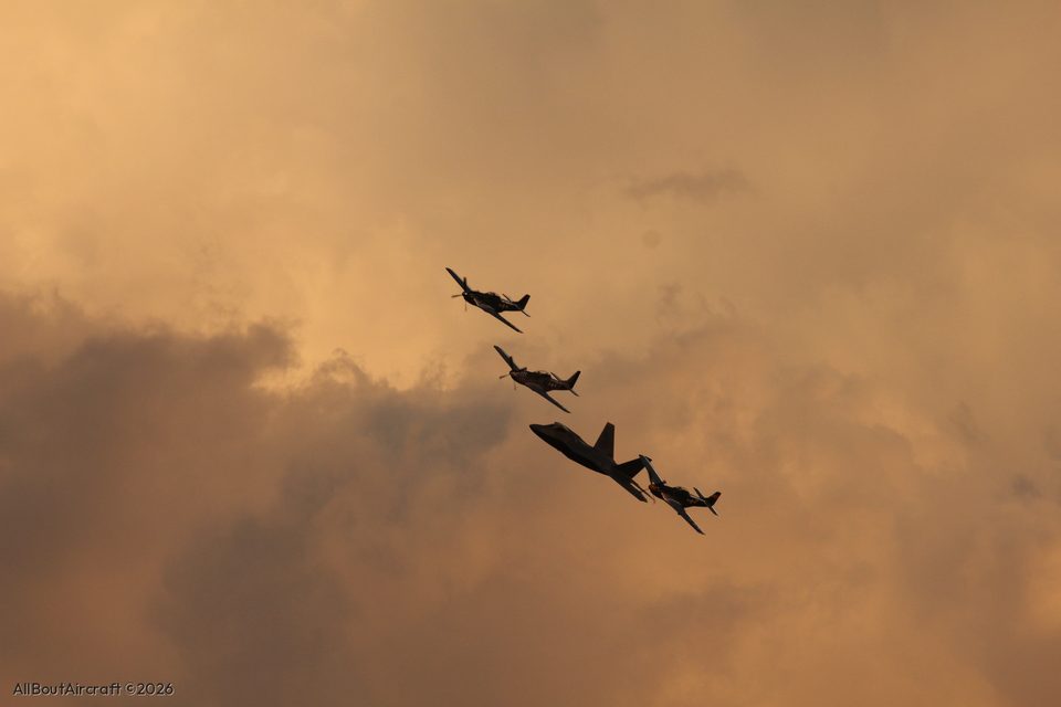 F-35 and three P-51 Mustangs in the evening cloud